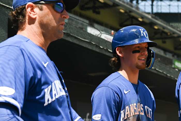 May 9, 2022; Baltimore, Maryland, USA; Kansas City Royals shortstop Bobby Witt Jr. (7) stands with manager Mike Matheny (22) int the dugout during the second inning against the Baltimore Orioles at Oriole Park at Camden Yards. Mandatory Credit: Tommy Gilligan-USA TODAY Sports